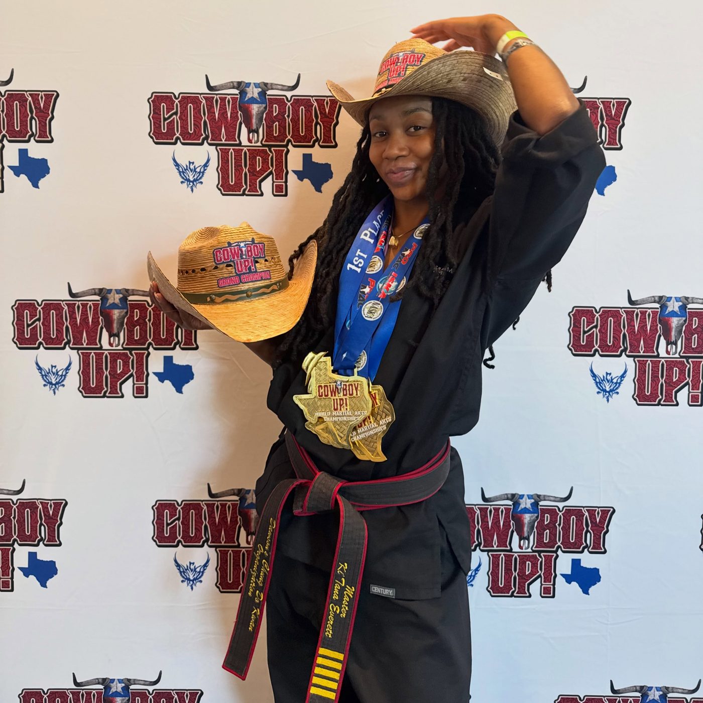 Ki'Tana Everett in a cowboy hat with her medals at Cowboy Up 2026